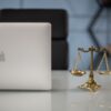 Scales of justice balanced with technology on a lawyer’s desk — agentic AI for law firms